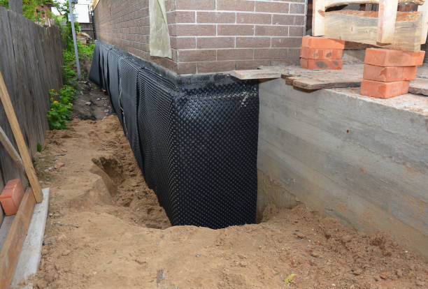 Happy homeowners after waterproofing job in Forestville